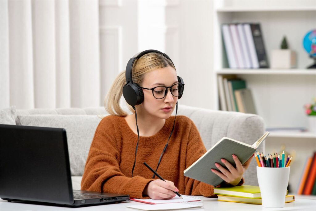 student online cute girl glasses sweater studying computer reading book